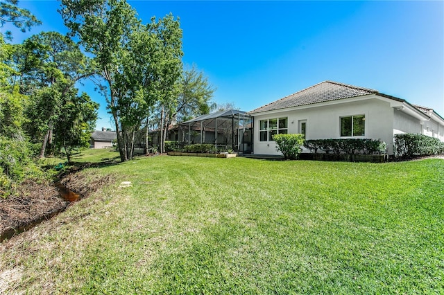 11938 Royce Waterford Cir, Tampa, FL 33626 - view of grassy yard featuring glass enclosure