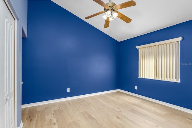 11938 Royce Waterford Cir, Tampa, FL 33626 - empty room with lofted ceiling, wood finished floors, a ceiling fan, and baseboards