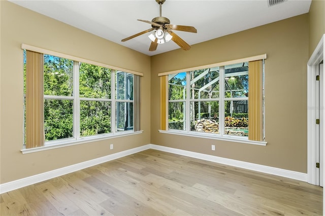 11938 Royce Waterford Cir, Tampa, FL 33626 - spare room featuring light wood-type flooring, baseboards, and a ceiling fan