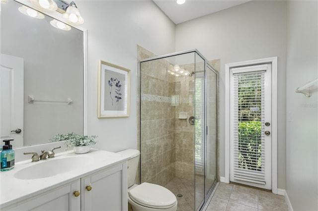 11938 Royce Waterford Cir, Tampa, FL 33626 - bathroom featuring a shower stall, vanity, toilet, and tile patterned floors