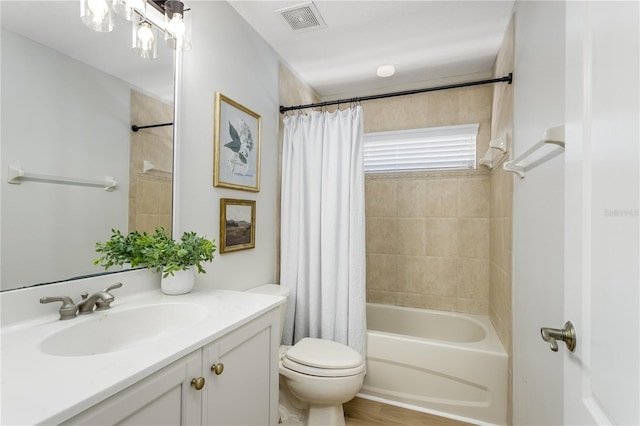 11938 Royce Waterford Cir, Tampa, FL 33626 - bathroom featuring vanity, shower / bath combo with shower curtain, and toilet