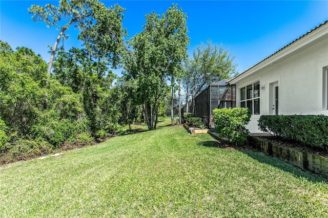 11938 Royce Waterford Cir, Tampa, FL 33626 - view of grassy yard with a lanai