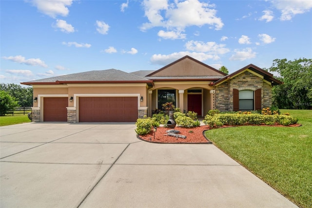 4608 Scott Rd, Lutz, FL 33558 - view of front of home featuring stone siding, driveway, stucco siding, and an attached garage