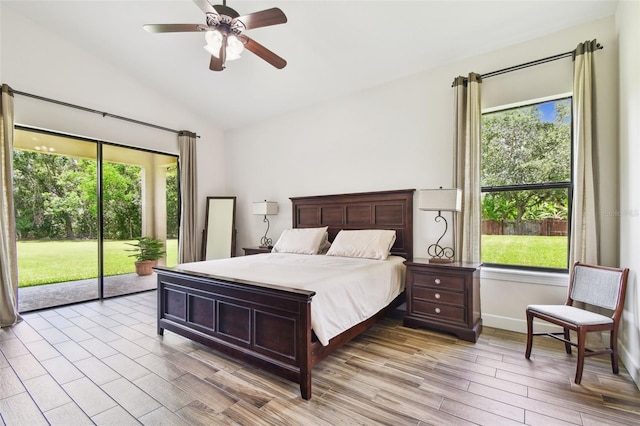 4608 Scott Rd, Lutz, FL 33558 - bedroom featuring access to exterior, lofted ceiling, multiple windows, wood finished floors, and ceiling fan