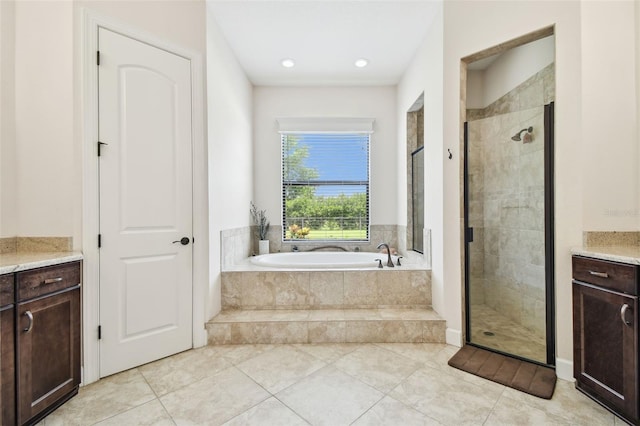 4608 Scott Rd, Lutz, FL 33558 - full bath with a garden tub, vanity, a stall shower, and tile patterned flooring