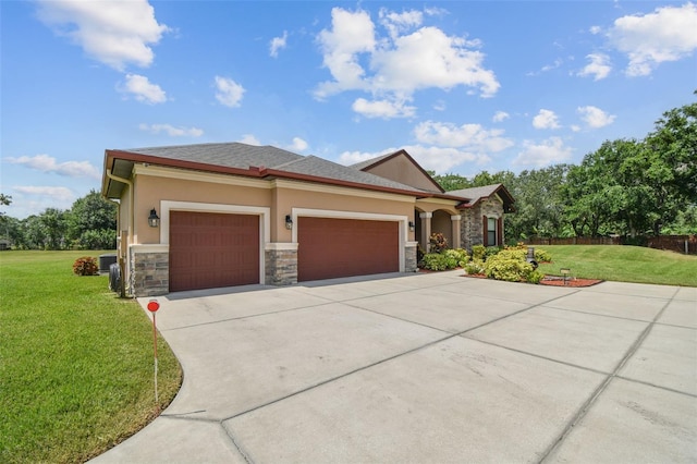 4608 Scott Rd, Lutz, FL 33558 - view of front of property with stone siding, a front lawn, an attached garage, concrete driveway, and stucco siding