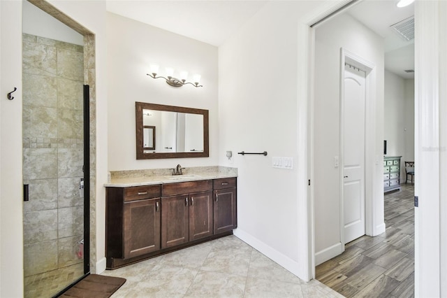 4608 Scott Rd, Lutz, FL 33558 - bathroom with vanity, a shower stall, and baseboards