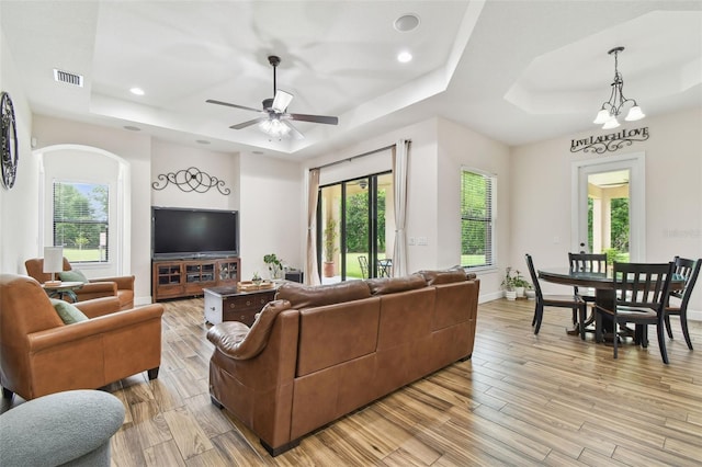 4608 Scott Rd, Lutz, FL 33558 - living area with a tray ceiling, plenty of natural light, light wood-style floors, and recessed lighting