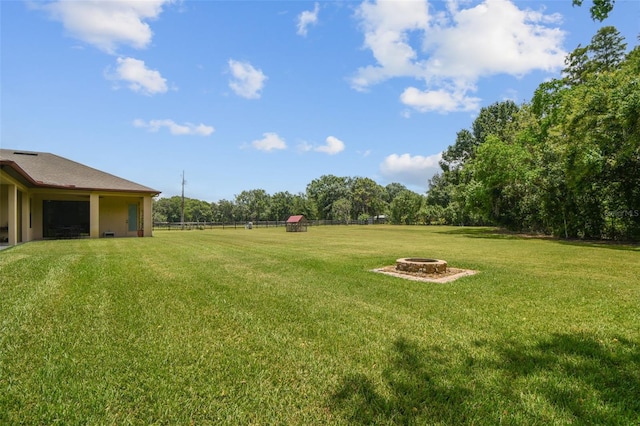 4608 Scott Rd, Lutz, FL 33558 - view of green lawn with a fire pit