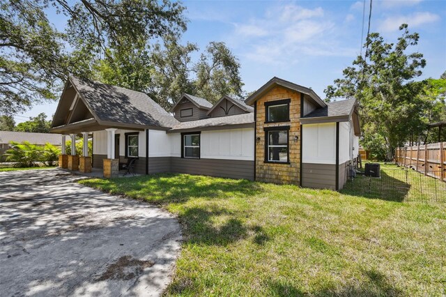 816 9th Ave SW, Largo, FL 33770 - view of front of house with roof with shingles and central air condition unit