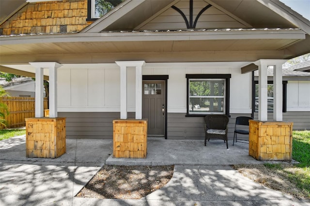 816 9th Ave SW, Largo, FL 33770 - property entrance featuring a porch and board and batten siding