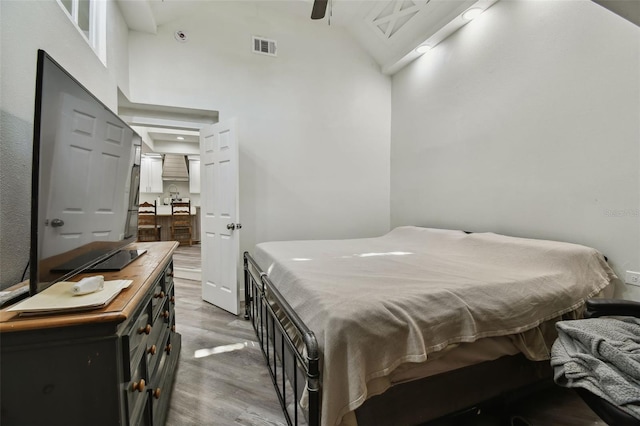 816 9th Ave SW, Largo, FL 33770 - bedroom featuring high vaulted ceiling and light wood finished floors