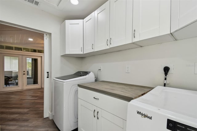 816 9th Ave SW, Largo, FL 33770 - washroom featuring cabinet space, dark wood-type flooring, washer and dryer, and french doors