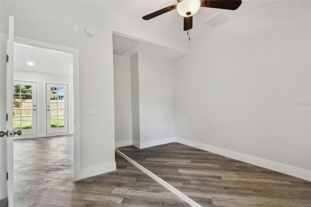 816 9th Ave SW, Largo, FL 33770 - unfurnished room featuring a ceiling fan, wood finished floors, attic access, and baseboards