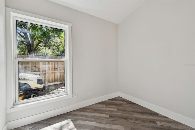 816 9th Ave SW, Largo, FL 33770 - empty room with baseboards and dark wood-style flooring