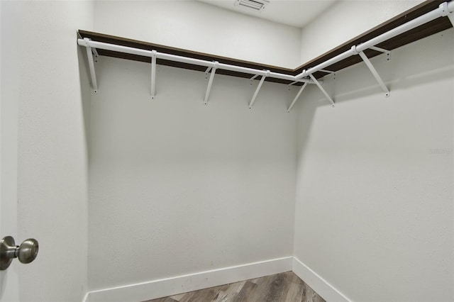816 9th Ave SW, Largo, FL 33770 - walk in closet featuring dark wood finished floors