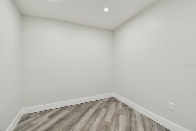 816 9th Ave SW, Largo, FL 33770 - unfurnished room with baseboards, light wood finished floors, and recessed lighting