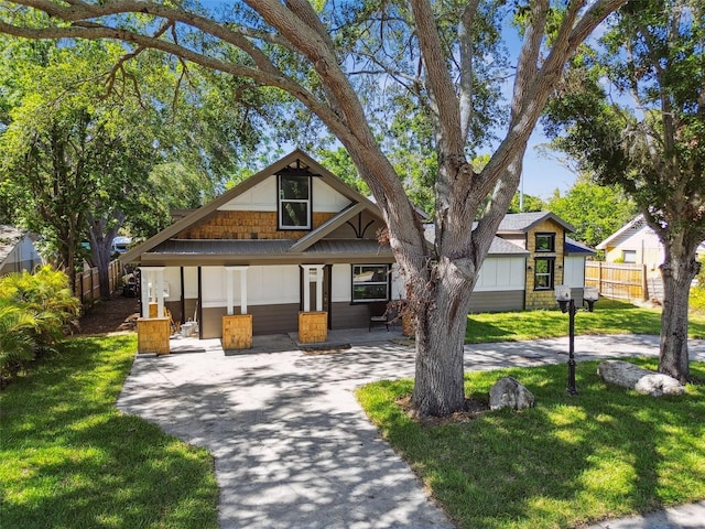 816 9th Ave SW, Largo, FL 33770 - view of front facade featuring covered porch and driveway