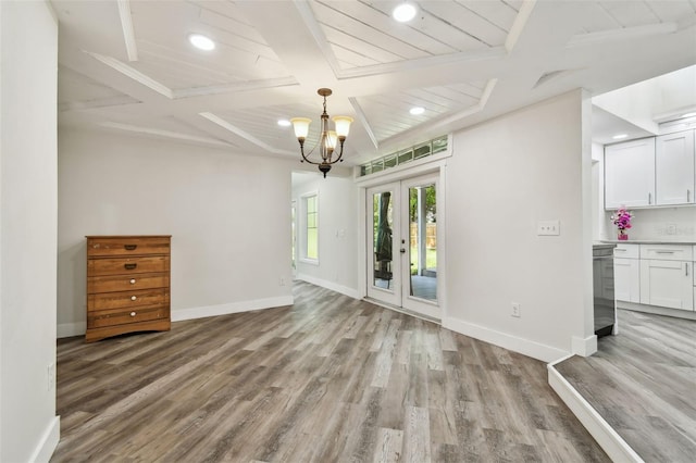816 9th Ave SW, Largo, FL 33770 - unfurnished dining area featuring coffered ceiling, light wood-style flooring, baseboards, beamed ceiling, and recessed lighting