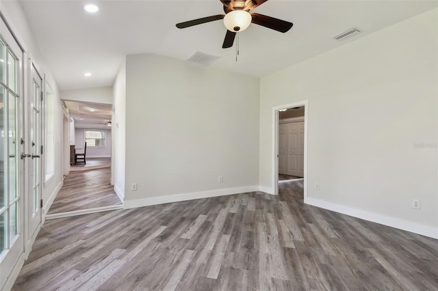 816 9th Ave SW, Largo, FL 33770 - unfurnished room with a ceiling fan, wood finished floors, recessed lighting, baseboards, and french doors