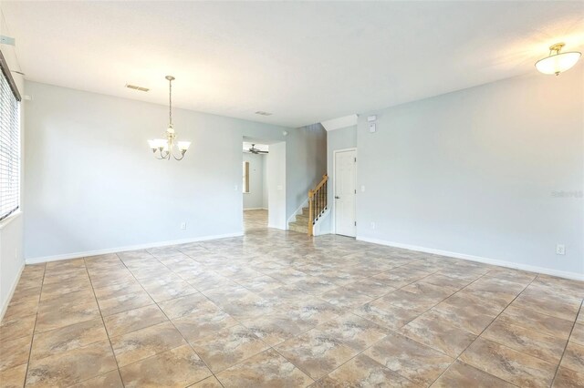 1769 Strathmore Cir, Mount Dora, FL 32757 - empty room with a chandelier, stairs, and baseboards