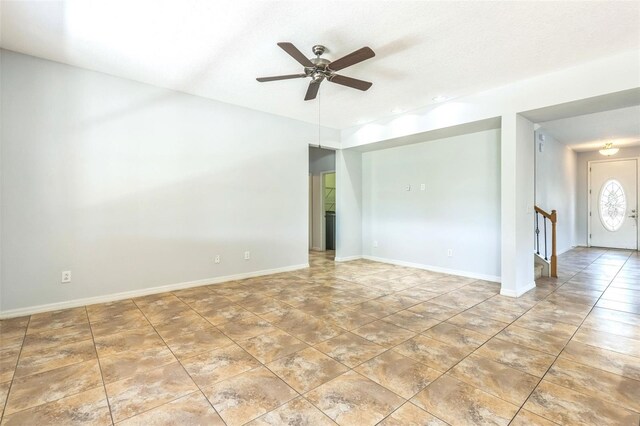 1769 Strathmore Cir, Mount Dora, FL 32757 - unfurnished room with a ceiling fan, tile patterned floors, and baseboards