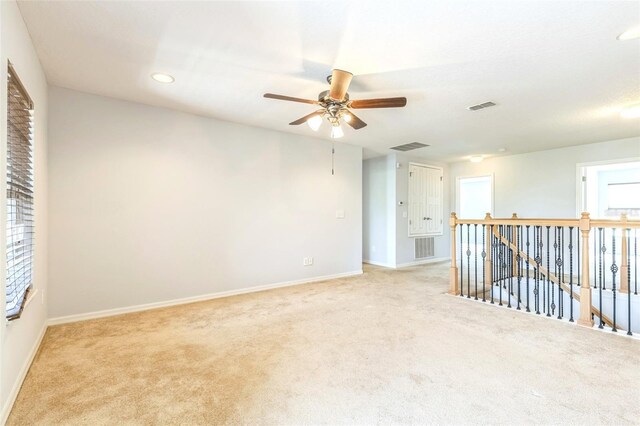 1769 Strathmore Cir, Mount Dora, FL 32757 - spare room featuring light colored carpet, baseboards, a ceiling fan, and recessed lighting