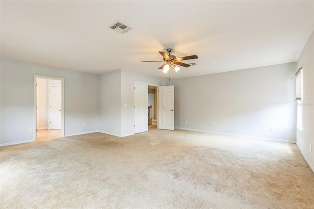 1769 Strathmore Cir, Mount Dora, FL 32757 - unfurnished room with a ceiling fan, light colored carpet, and baseboards