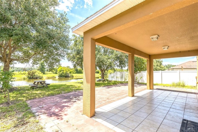 1769 Strathmore Cir, Mount Dora, FL 32757 - view of patio featuring a water view