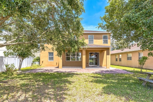 1769 Strathmore Cir, Mount Dora, FL 32757 - back of house featuring a patio and stucco siding