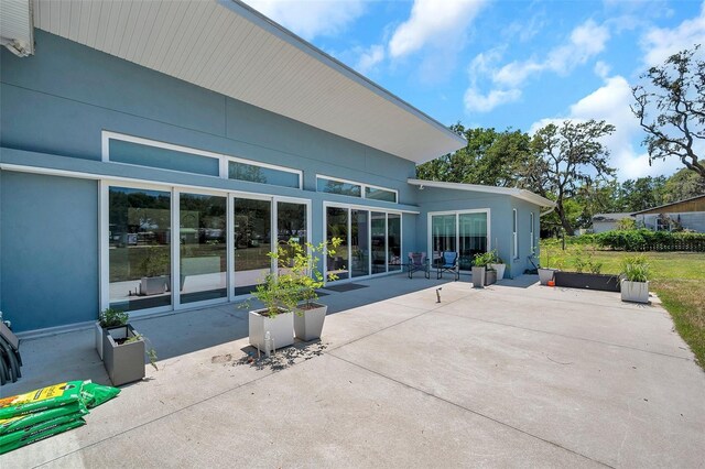 10722 Sumner Rd, Wimauma, FL 33598 - rear view of house with a patio