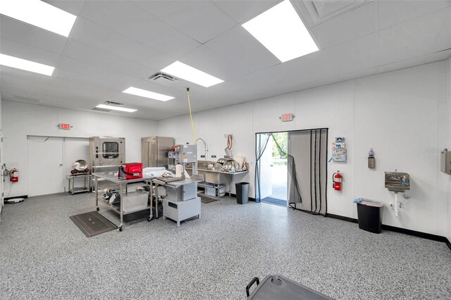 10722 Sumner Rd, Wimauma, FL 33598 - miscellaneous room featuring speckle patterned floor