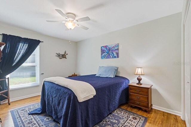 105 Douglas St, Homosassa, FL 34446 - bedroom featuring wood finished floors, baseboards, and a ceiling fan