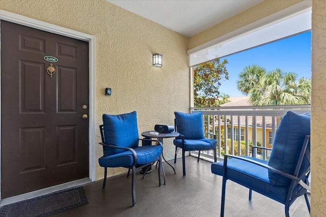 10764 70th Ave Unit 3206, Seminole, FL 33772 - doorway to property with stucco siding and a balcony