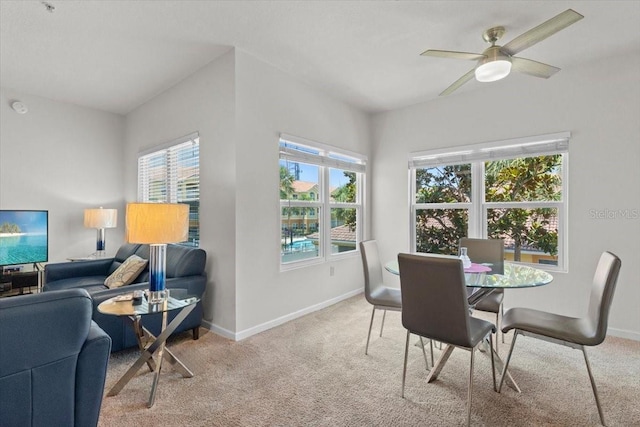 10764 70th Ave Unit 3206, Seminole, FL 33772 - dining room with light carpet, baseboards, and a ceiling fan