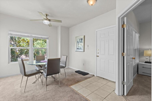 10764 70th Ave Unit 3206, Seminole, FL 33772 - dining space with light carpet, ceiling fan, baseboards, and light tile patterned floors