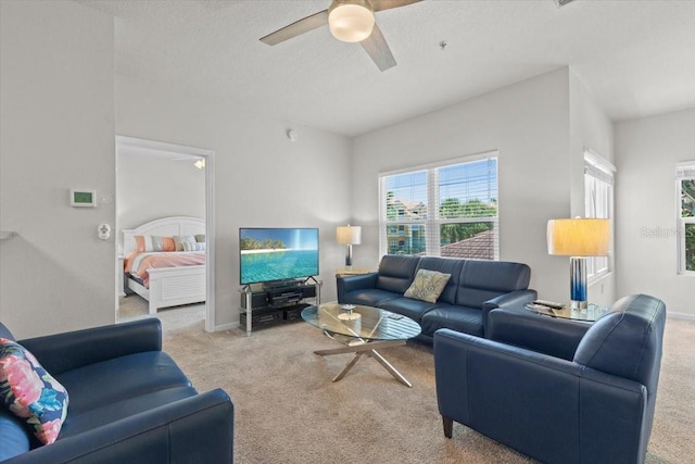 10764 70th Ave Unit 3206, Seminole, FL 33772 - carpeted living room with a ceiling fan, a textured ceiling, and baseboards