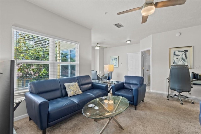 10764 70th Ave Unit 3206, Seminole, FL 33772 - living room featuring a ceiling fan, light carpet, baseboards, and an office area