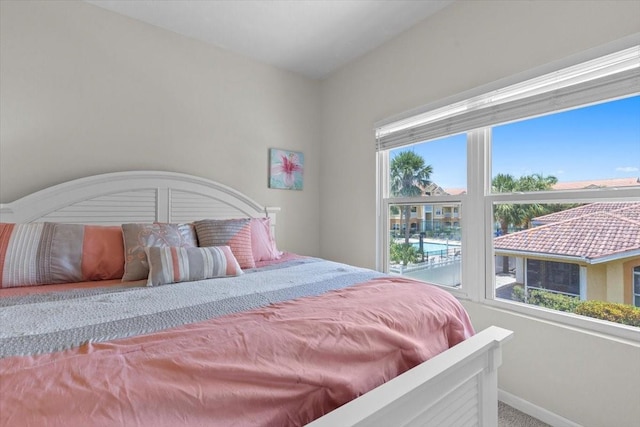 10764 70th Ave Unit 3206, Seminole, FL 33772 - carpeted bedroom featuring baseboards
