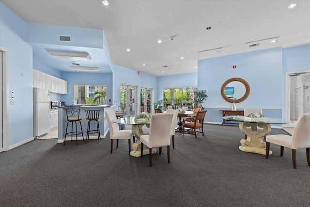 10764 70th Ave Unit 3206, Seminole, FL 33772 - carpeted dining area featuring baseboards and recessed lighting