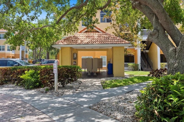 10764 70th Ave Unit 3206, Seminole, FL 33772 - view of front facade with stucco siding and a tile roof