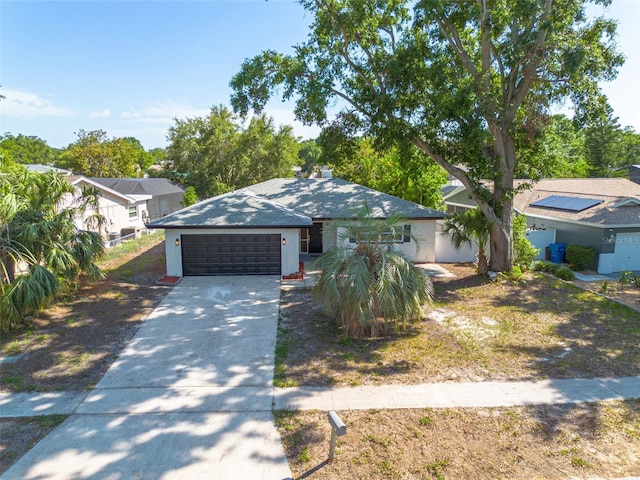 2436 Beacon Groves Blvd, Palm Harbor, FL 34683 - view of front of house with an attached garage, driveway, and a shingled roof