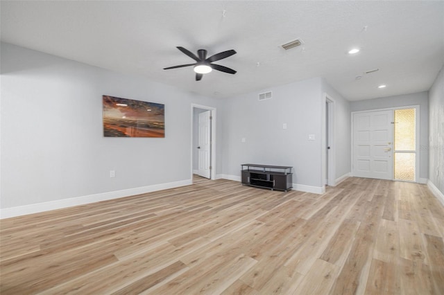 2436 Beacon Groves Blvd, Palm Harbor, FL 34683 - unfurnished living room with light wood finished floors, ceiling fan, baseboards, and recessed lighting