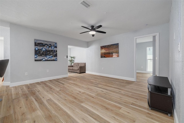 2436 Beacon Groves Blvd, Palm Harbor, FL 34683 - unfurnished room featuring light wood-type flooring, ceiling fan, and baseboards