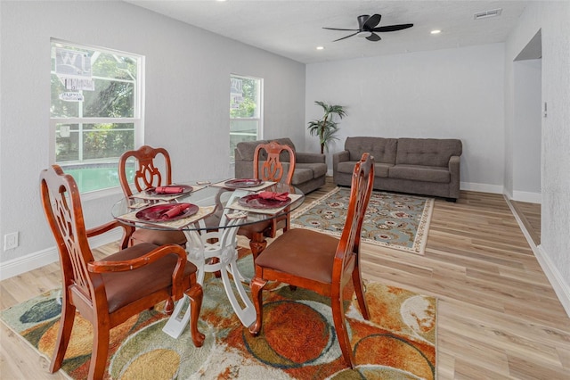 2436 Beacon Groves Blvd, Palm Harbor, FL 34683 - dining room with a ceiling fan, wood finished floors, baseboards, and recessed lighting