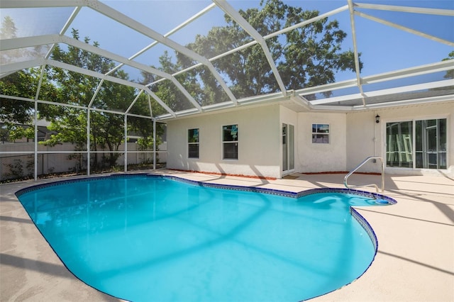 2436 Beacon Groves Blvd, Palm Harbor, FL 34683 - swimming pool featuring a patio area and glass enclosure