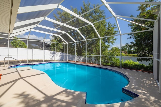 2436 Beacon Groves Blvd, Palm Harbor, FL 34683 - view of swimming pool featuring a patio area and glass enclosure