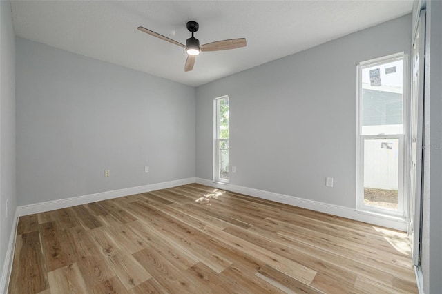 2436 Beacon Groves Blvd, Palm Harbor, FL 34683 - unfurnished room with a ceiling fan, light wood-style flooring, and baseboards