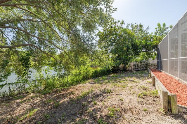 2436 Beacon Groves Blvd, Palm Harbor, FL 34683 - view of yard featuring glass enclosure