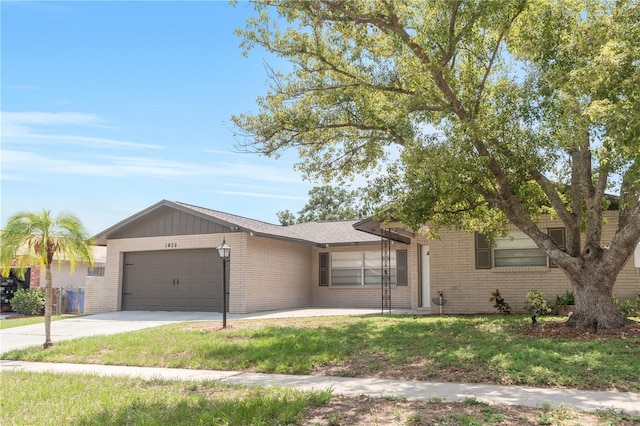 1406 Valley Pl, Brandon, FL 33510 - view of front of property with brick siding, a garage, concrete driveway, and a front lawn